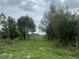 Wooded lot with a gated entrance at 33255 State Road 70 E, Myakka City, FL 34251