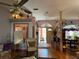 Living room with hardwood floors, comfortable seating and access to the dining room at 33255 State Road 70 E, Myakka City, FL 34251