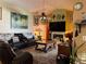 Living Room with leather couches and a fireplace at 33255 State Road 70 E, Myakka City, FL 34251