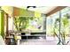 Relaxing screened porch with brick flooring and vibrant decor at 33255 State Road 70 E, Myakka City, FL 34251
