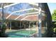 Screened-in pool with surrounding patio at 33255 State Road 70 E, Myakka City, FL 34251