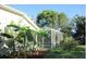 Home exterior showcasing a pool and tropical landscaping at 33255 State Road 70 E, Myakka City, FL 34251