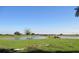 Serene landscape with a pond and lush green pasture at 33255 State Road 70 E, Myakka City, FL 34251