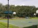 Outdoor community basketball court with a shaded seating area at 19334 Autumn Woods Ave, Tampa, FL 33647