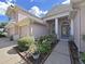 Two-story house with a welcoming entrance and manicured landscaping at 19334 Autumn Woods Ave, Tampa, FL 33647