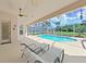 Relaxing poolside patio with lounge chairs at 19334 Autumn Woods Ave, Tampa, FL 33647