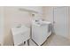 Laundry room with washer, dryer, and utility sink at 19334 Autumn Woods Ave, Tampa, FL 33647