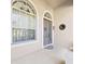 Bright and airy front entry with arched windows and a decorative door at 19334 Autumn Woods Ave, Tampa, FL 33647