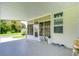 Covered patio entrance to mobile home with window and door at 6048 Ridgeway Dr, Zephyrhills, FL 33542