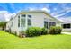 Immaculately landscaped mobile home exterior at 6048 Ridgeway Dr, Zephyrhills, FL 33542