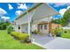 Carport with attached shed and landscaping at 6048 Ridgeway Dr, Zephyrhills, FL 33542