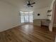 Bright office space with wood-look flooring and built-in shelving at 6048 Ridgeway Dr, Zephyrhills, FL 33542