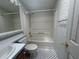 Bathroom with tub, shower, and neutral colored walls at 6048 Ridgeway Dr, Zephyrhills, FL 33542