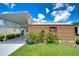 Carport and shed with landscaping and plants at 6048 Ridgeway Dr, Zephyrhills, FL 33542