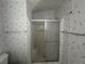 Bathroom with shower stall and neutral colored walls at 6048 Ridgeway Dr, Zephyrhills, FL 33542