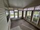 Spacious sunroom with ample natural light and window coverings at 6048 Ridgeway Dr, Zephyrhills, FL 33542