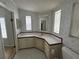 Clean bathroom with corner sink, checkered floor, and shower/tub combo at 6048 Ridgeway Dr, Zephyrhills, FL 33542