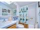 Clean bathroom with shower/tub combo, vanity, and decorative shower curtain at 6048 Ridgeway Dr, Zephyrhills, FL 33542
