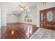 Spacious living room features hardwood floors, high ceilings, and a large window at 6536 Northlake Dr, Zephyrhills, FL 33542