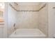 Clean bathroom shower with neutral-toned tile and updated fixtures at 6536 Northlake Dr, Zephyrhills, FL 33542