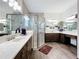 Elegant bathroom with dual vanities, a large shower, and modern fixtures at 15503 Corona Del Mar Dr, Wimauma, FL 33598