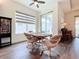 Bright breakfast nook with a small table and chairs, near sliding doors to the backyard at 15503 Corona Del Mar Dr, Wimauma, FL 33598