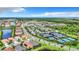 Aerial view of a residential community with pools, tennis courts, and lush landscaping at 15503 Corona Del Mar Dr, Wimauma, FL 33598