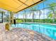 Inviting pool area with covered patio, spa, and pool lift at 15503 Corona Del Mar Dr, Wimauma, FL 33598