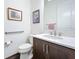 Small bathroom with dark vanity, marble countertop, and grab bar at 15503 Corona Del Mar Dr, Wimauma, FL 33598
