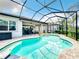 Inviting pool area with covered patio and retractable awning at 15503 Corona Del Mar Dr, Wimauma, FL 33598