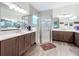 Spa-like bathroom featuring dual vanities, a large shower, and modern design at 15503 Corona Del Mar Dr, Wimauma, FL 33598