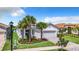 Single-Gathering house with a two-car garage and neatly landscaped yard at 15503 Corona Del Mar Dr, Wimauma, FL 33598