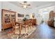 Open dining room with wood floors and access to entryway at 15503 Corona Del Mar Dr, Wimauma, FL 33598