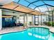 Relaxing pool area with covered patio and pool lift at 15503 Corona Del Mar Dr, Wimauma, FL 33598