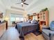 Spacious main bedroom with a large bed, built-in shelving, and plenty of natural light at 15503 Corona Del Mar Dr, Wimauma, FL 33598