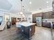 Open kitchen with large island, stainless steel appliances, and lots of counter space at 15503 Corona Del Mar Dr, Wimauma, FL 33598
