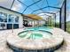 Enjoyable spa with covered patio and outdoor seating area at 15503 Corona Del Mar Dr, Wimauma, FL 33598
