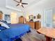 Comfortable bedroom with a king-size bed and access to a private bathroom at 15503 Corona Del Mar Dr, Wimauma, FL 33598