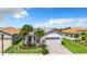 Single-Gathering home with a two-car garage and well-maintained landscaping at 15503 Corona Del Mar Dr, Wimauma, FL 33598
