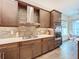 Modern kitchen with stainless steel appliances and a stylish backsplash at 15503 Corona Del Mar Dr, Wimauma, FL 33598