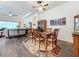 Dining room features wood table and chairs, and a ceiling fan at 15503 Corona Del Mar Dr, Wimauma, FL 33598