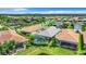 Aerial view of a desirable neighborhood with a tranquil lake at 15503 Corona Del Mar Dr, Wimauma, FL 33598