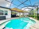 Resort-style pool with covered patio and ample seating at 15503 Corona Del Mar Dr, Wimauma, FL 33598