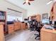 Spacious office with built-in wooden desks and two workstations at 15503 Corona Del Mar Dr, Wimauma, FL 33598