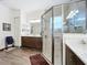 Elegant bathroom with a large shower, double vanity, and modern fixtures at 15503 Corona Del Mar Dr, Wimauma, FL 33598
