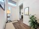 Entryway with a bench, plant, and mirror reflecting light at 15503 Corona Del Mar Dr, Wimauma, FL 33598