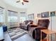 Relaxing sitting room with comfortable recliner chairs and large windows at 15503 Corona Del Mar Dr, Wimauma, FL 33598