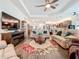 Open concept living room with comfortable seating and large TV at 15503 Corona Del Mar Dr, Wimauma, FL 33598