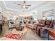 Open concept living room with comfortable seating, overlooking kitchen at 15503 Corona Del Mar Dr, Wimauma, FL 33598
