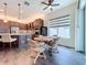 Modern kitchen with dark cabinetry, stainless steel appliances, and an island at 15503 Corona Del Mar Dr, Wimauma, FL 33598